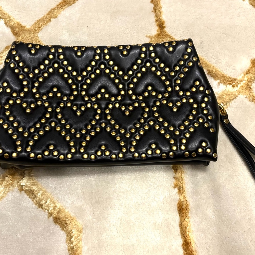 Rebecca Minkoff medium heart studded clutch with wrist strap